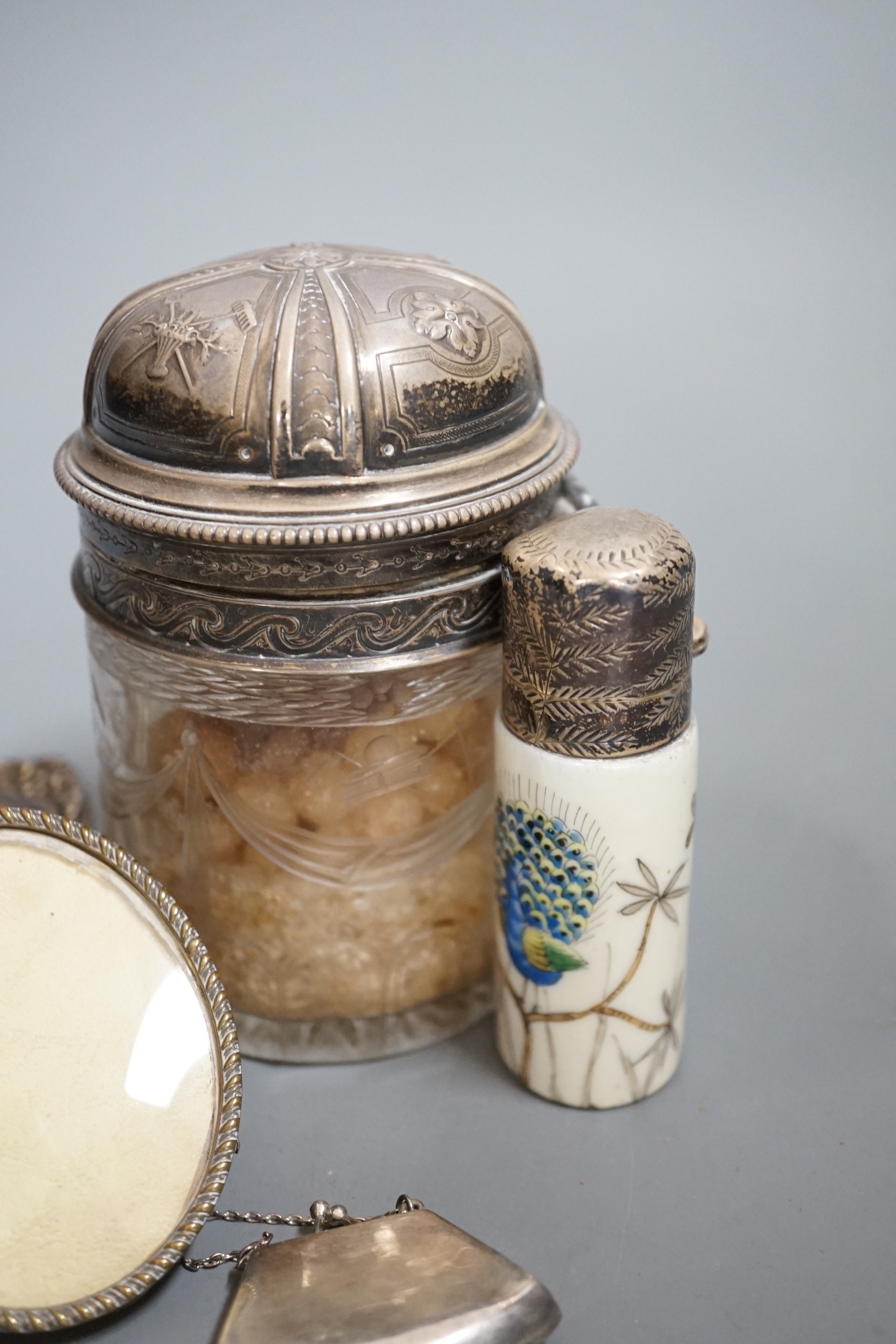 Four small silver mounted photograph frames, one brass frame, a silver lidded jar and one other and a 925 handbag pill box.